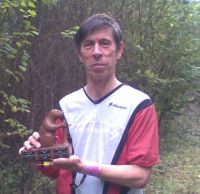 Bruce Marshall holding the Bill Stevens Trophy.